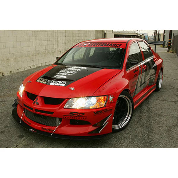 A front view of a red car fitted with APR Performance EVIL-R Widebody Aerodynamic Kit Mitsubishi Evolution VIII 2003-2005