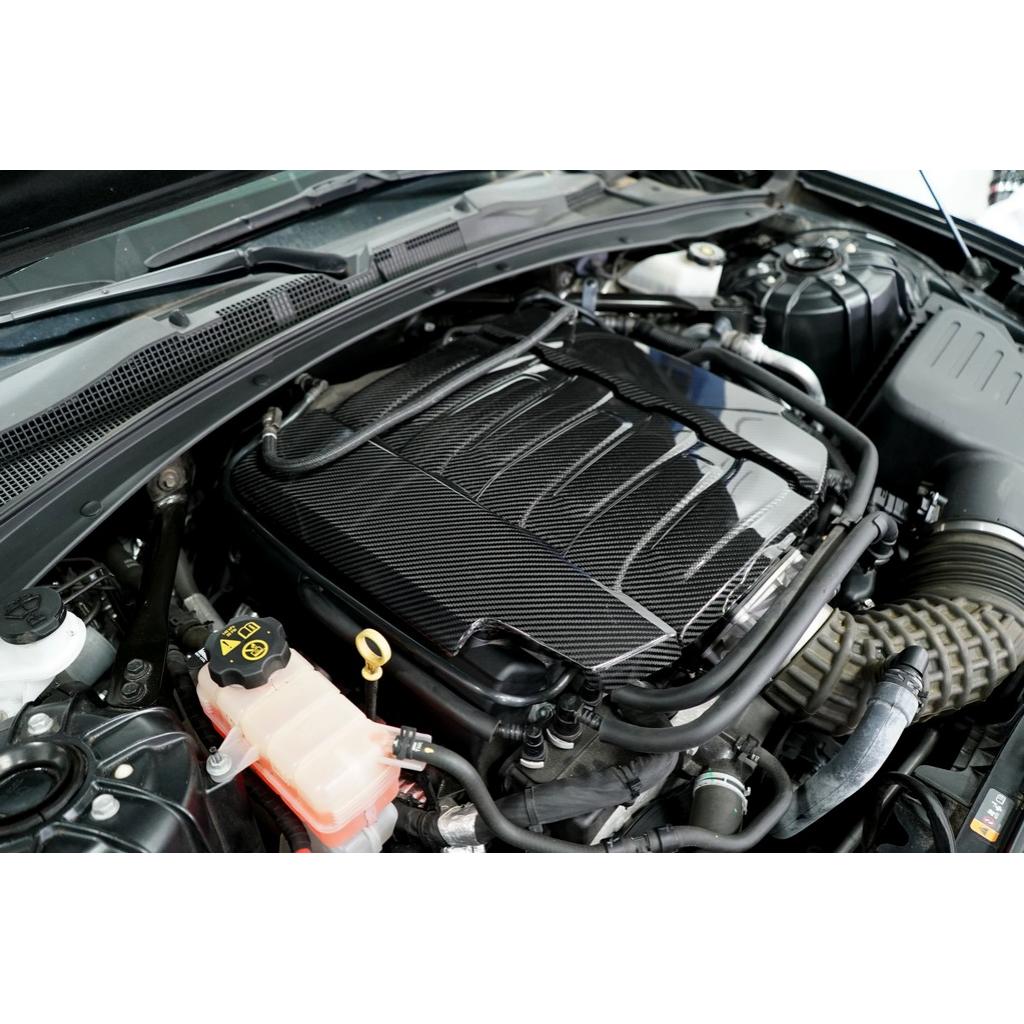 Carbon fiber engine cover with angular design pattern installed in engine bay over LT1 motor - APR Performance engine cover for Chevrolet Camaro SS LT1