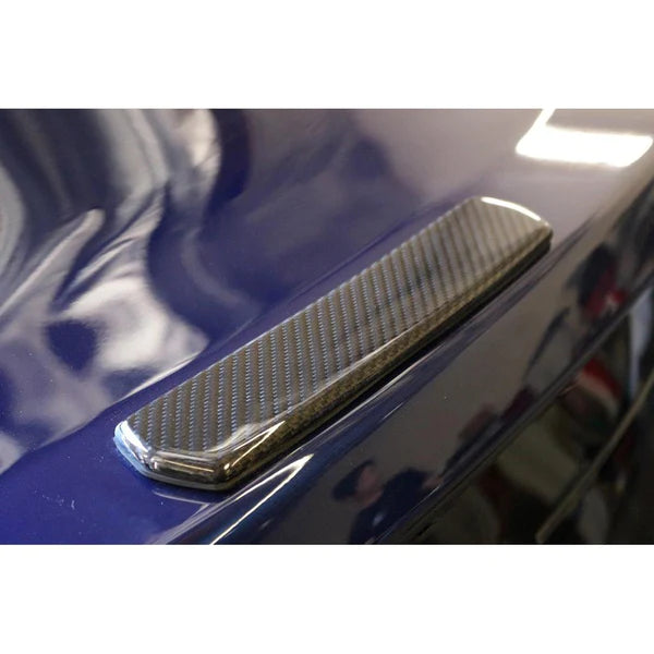 A close up view of factory spoiler center cover for APR Performance Ford Mustang S550 GTC-200 Adjustable Wing 2015-2017