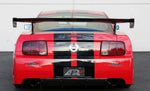 A back view of a red car fitted with APR Performance GT-R Widebody Aerodynamic Kit Ford Mustang S197 2005-2009