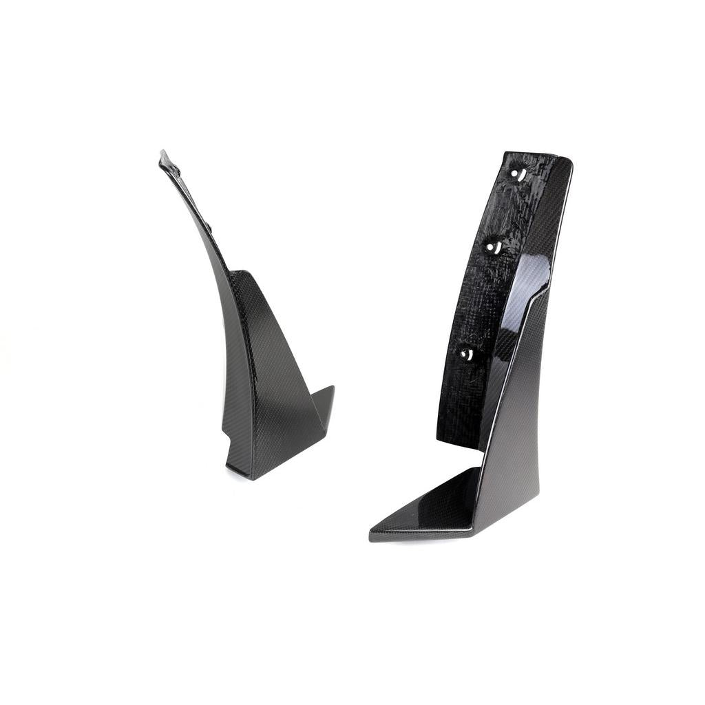 Two black carbon fiber triangular canards with mounting holes and aluminum brackets on white background - APR Performance front canards for Chevrolet C7 Corvette Z06