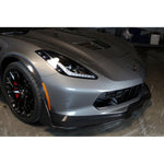 Black carbon fiber front airdam installed on silver Corvette Z06 positioned in garage setting - APR Performance front airdam for Chevrolet C7 Corvette Corvette Z06