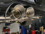 A close up view of Shark Werks Track Exhaust for Porsche 997 / 997.2 GT3 / RS exhaust tips fitted on a car