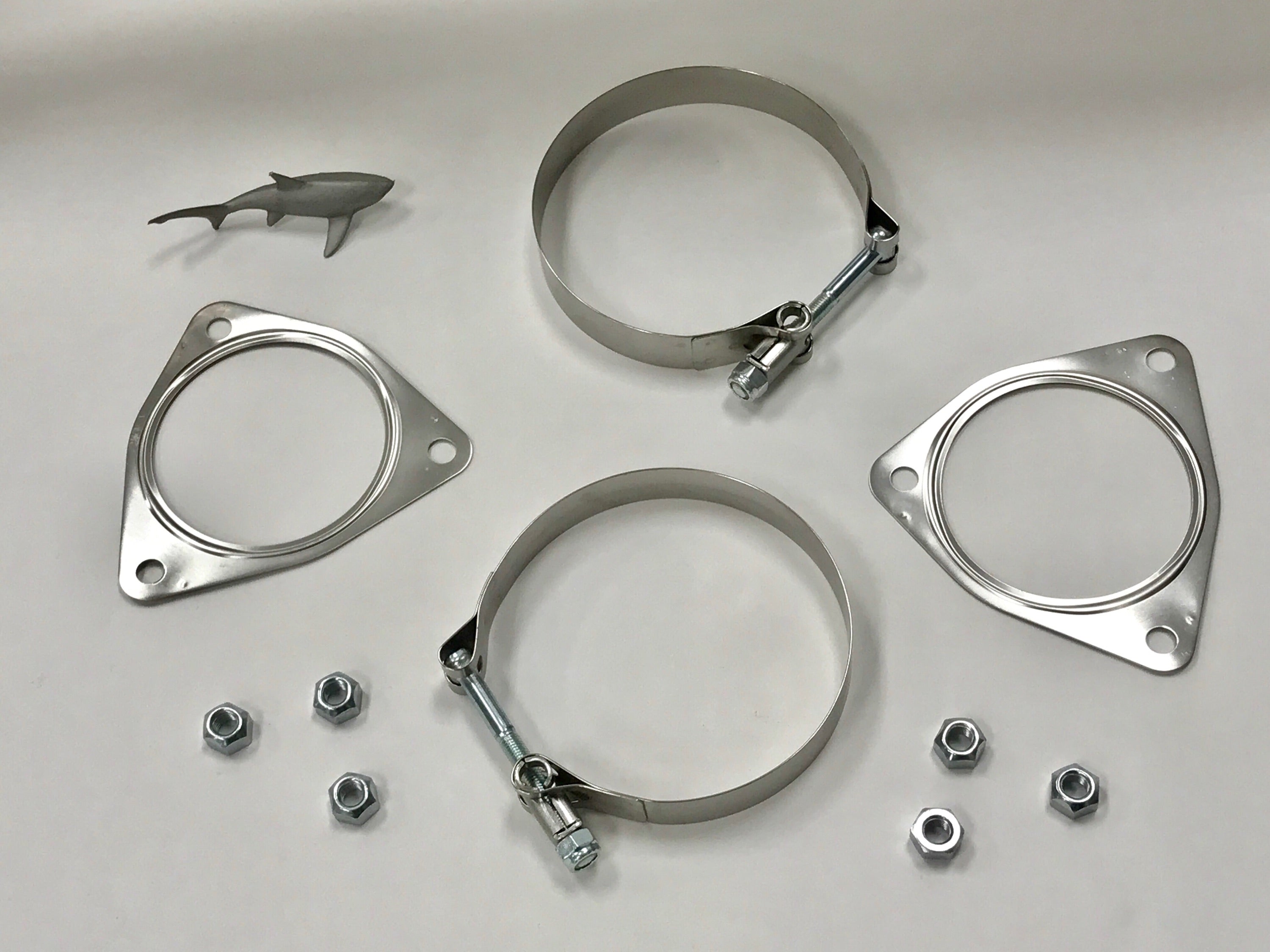 A close up view of Shark Werks Sport Exhaust for Porsche 991 Carrera / S hardwares with a white background