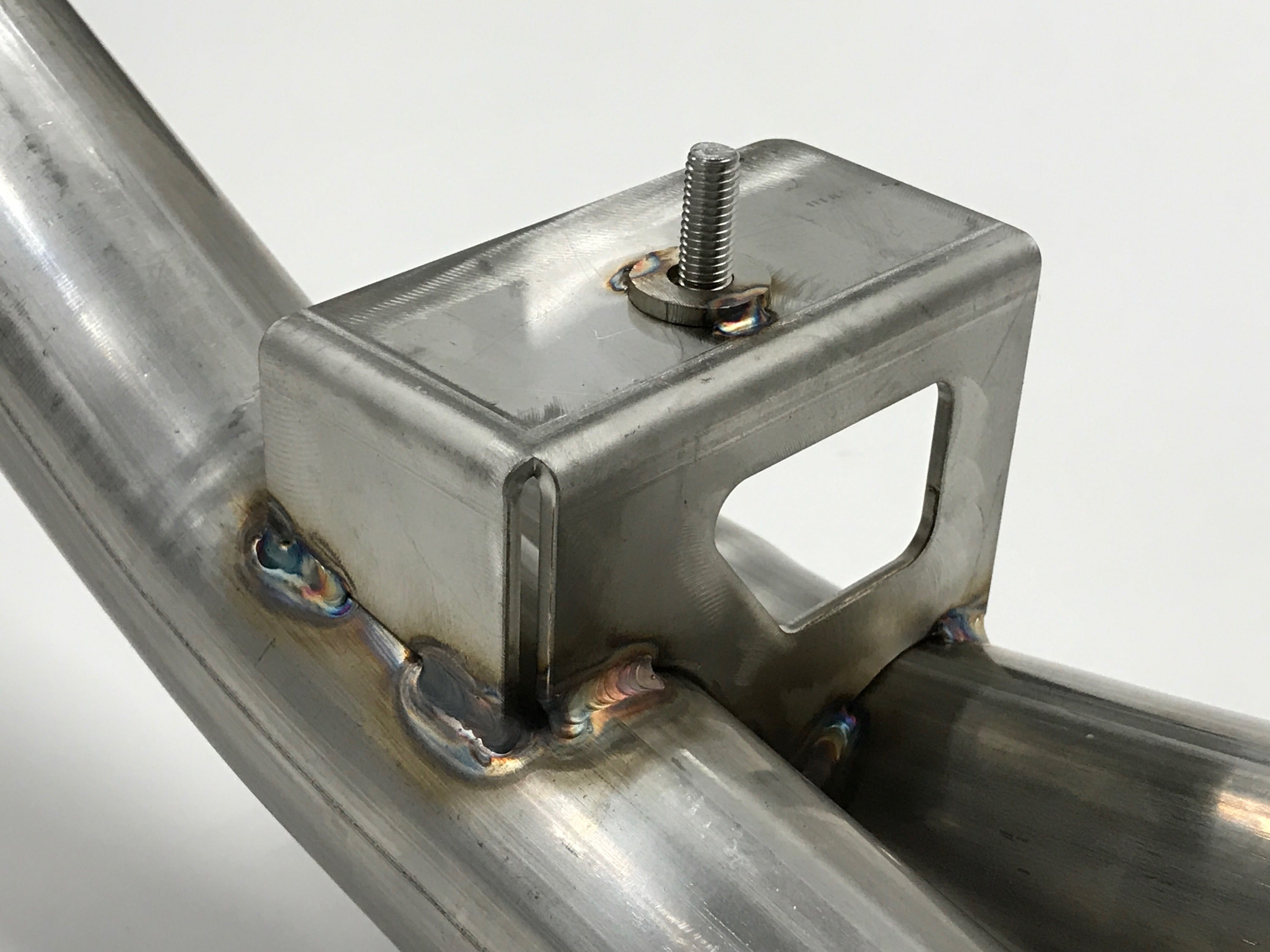 A close up view of Shark Werks Sport Exhaust for Porsche 997.2 Carrera / S / 4 / 4S / GTS with a white background