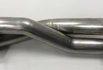 A close up view of Shark Werks Exhaust for Porsche 997.2 Turbo / S pipes with a white background
