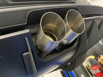 A close up view of Shark Werks Exhaust System for Porsche 992 GT3 / GT3RS exhaust tips in Silver fitted on a car