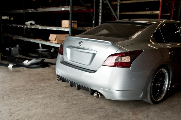 wide view of Stillen Rear Bumper Valance Diffuser [Unpainted] for Nissan Maxima 2009-2015 fitted inside a car