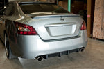 wide view of Stillen Rear Bumper Valance Diffuser [Unpainted] for Nissan Maxima 2009-2015 fitted inside a car