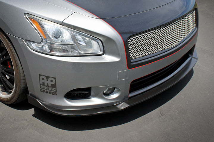 close view of Stillen Front Bumper Splitter for Nissan Maxima 2009-2015 fitted inside a car