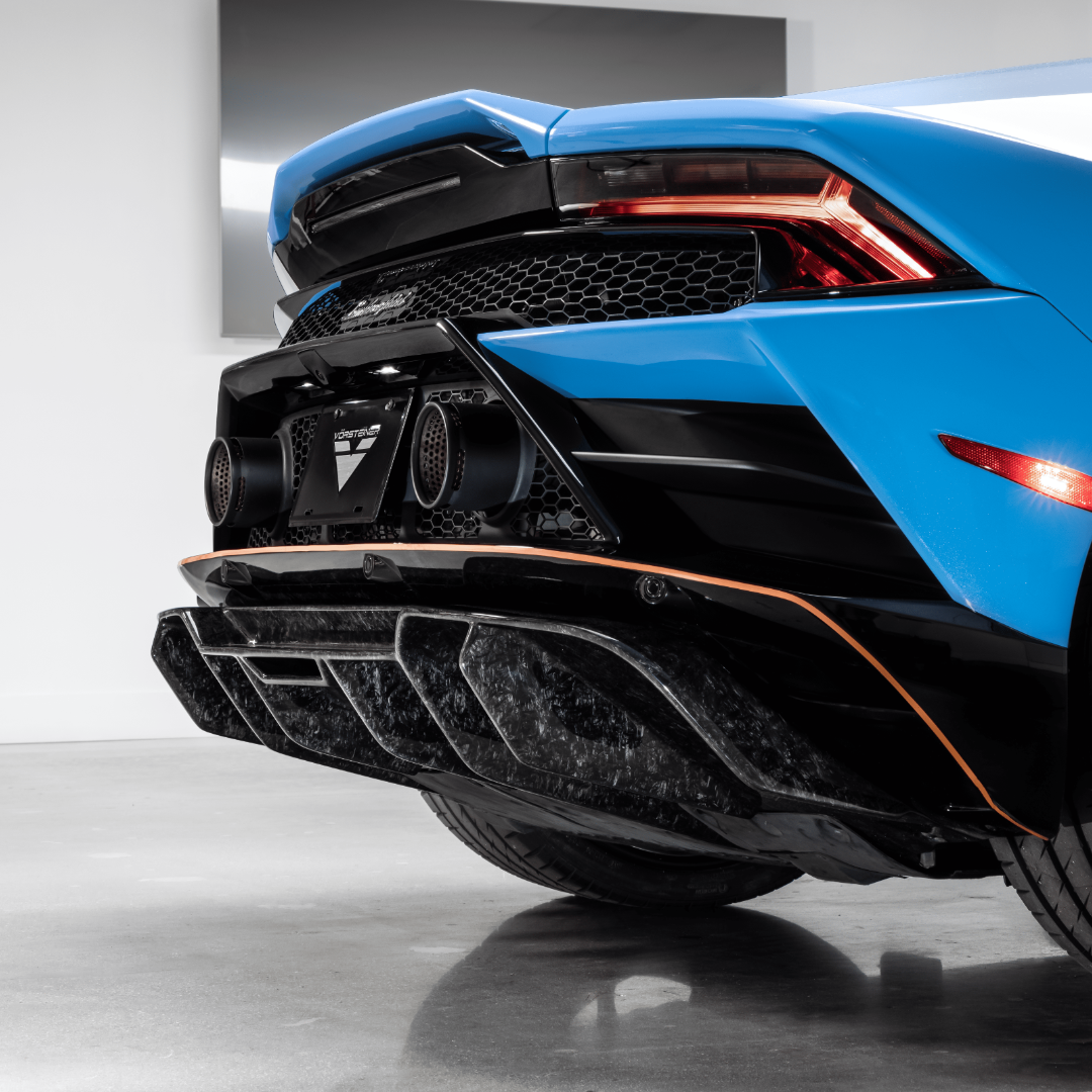 Monza diffuser on blue Huracan, low rear 3/4 view