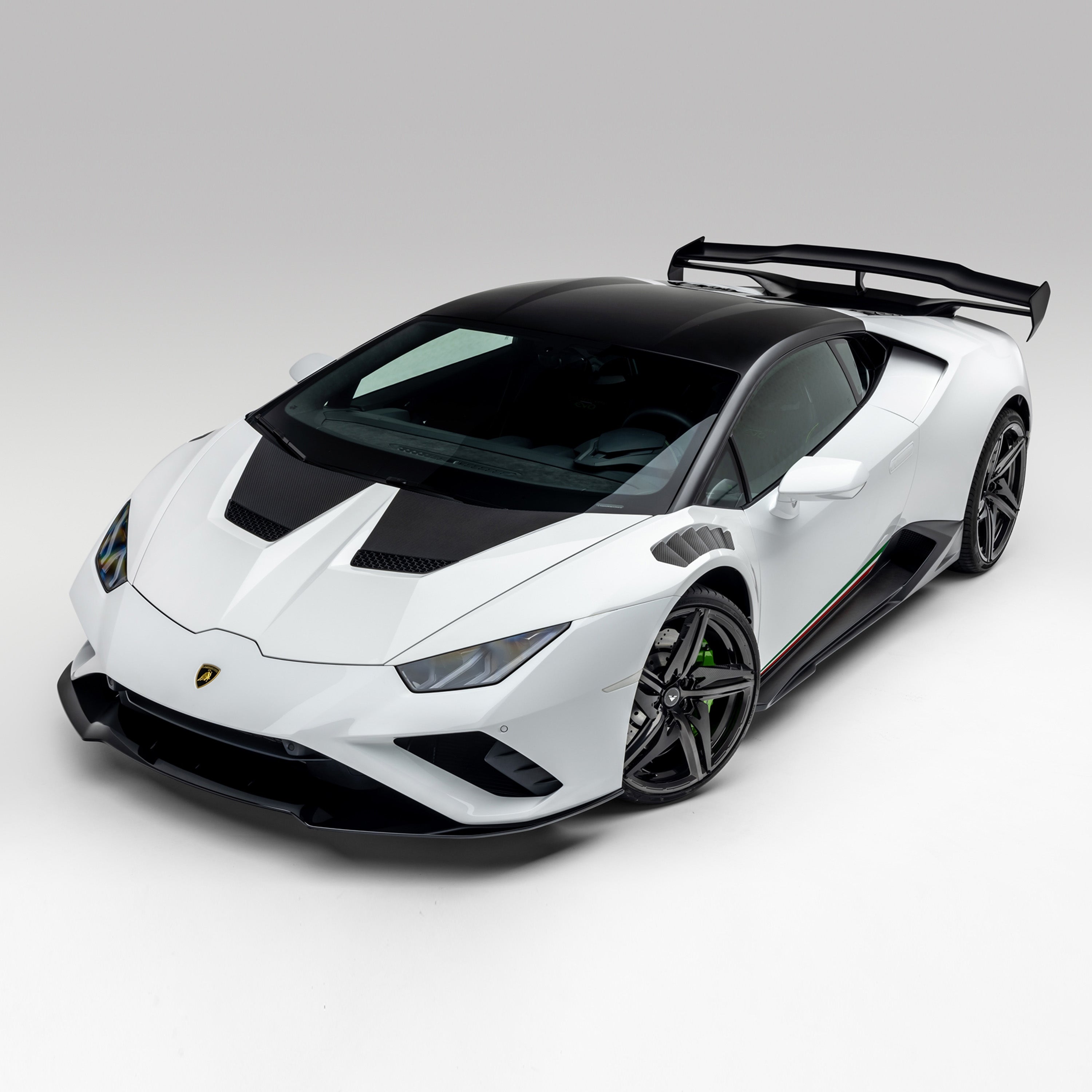 White Huracan EVO with Monza side blades, high front 3/4 view