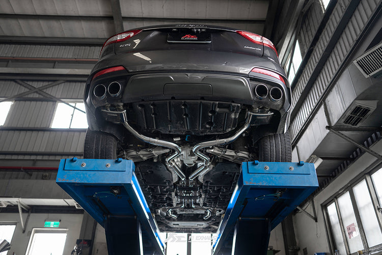 A back view of a lifted car fitted with FI Exhaust Valvetronic Cat-Back System For Maserati Levante Trofeo 2017+