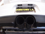 A close up view of Shark Werks 100mm Exhaust Tips for Porsche 991 / 991.2 GT3 / RS / R fitted on a car from behind 