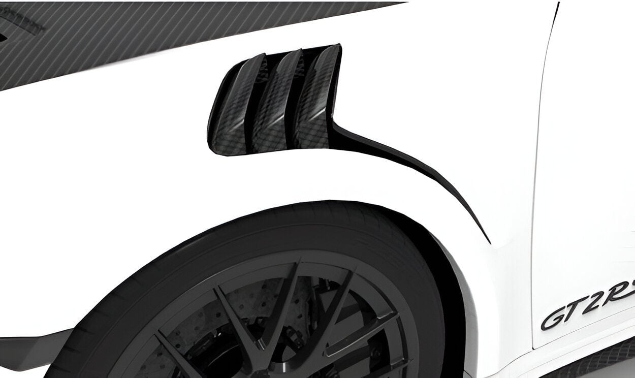 Carbon fender vents above the front wheel of a white Porsche GT2 RS