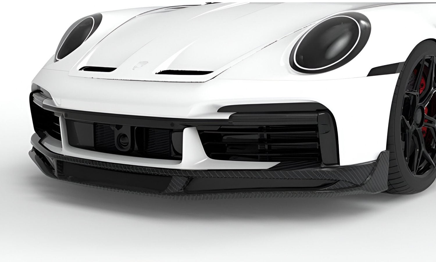 Carbon front aero lip on a white Porsche 911 Turbo S (992)