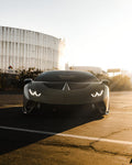 Grey Lamborghini Huracan Performante front view with the complete aero kit at sunset