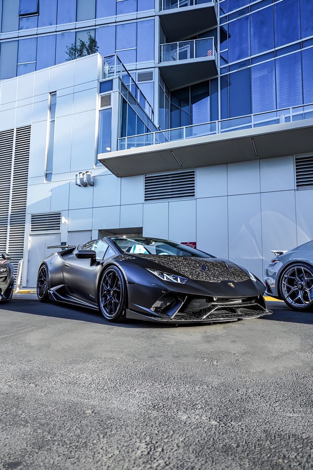 Black Huracan Performante Spyder with forged carbon lip, front three-quarter