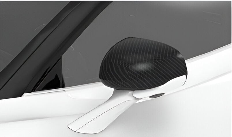 Carbon mirror cap fitted on a white McLaren 720S