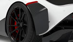 Carbon rear bumper flap behind the rear wheel of a white McLaren 720S