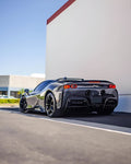 Grey Ferrari SF90 rear three-quarter showing the carbon rear diffuser