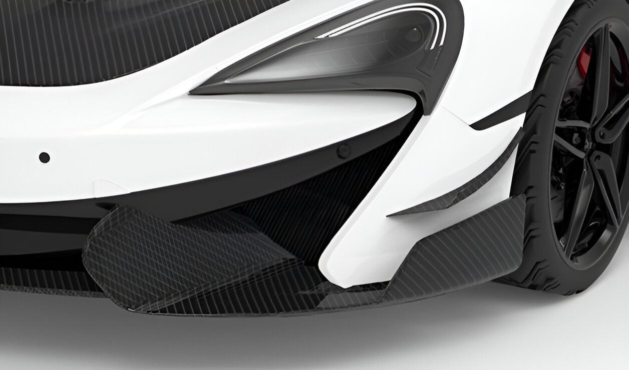 Carbon front aero blades on the bumper corners of a white McLaren 570S