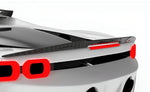 Carbon trunk spoiler above the tail lights of a white Ferrari SF90