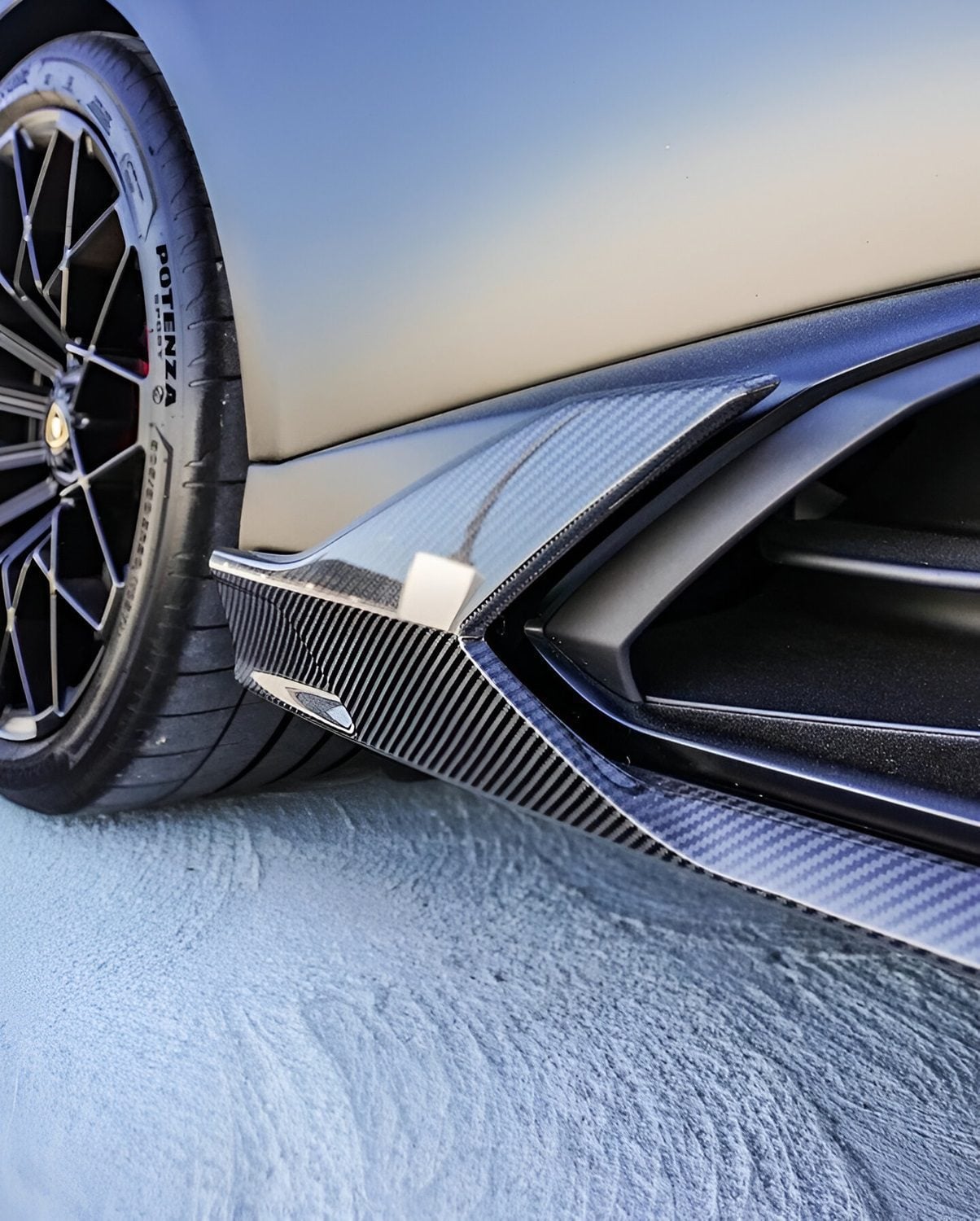 Carbon side skirt on a grey Huracan STO, close-up