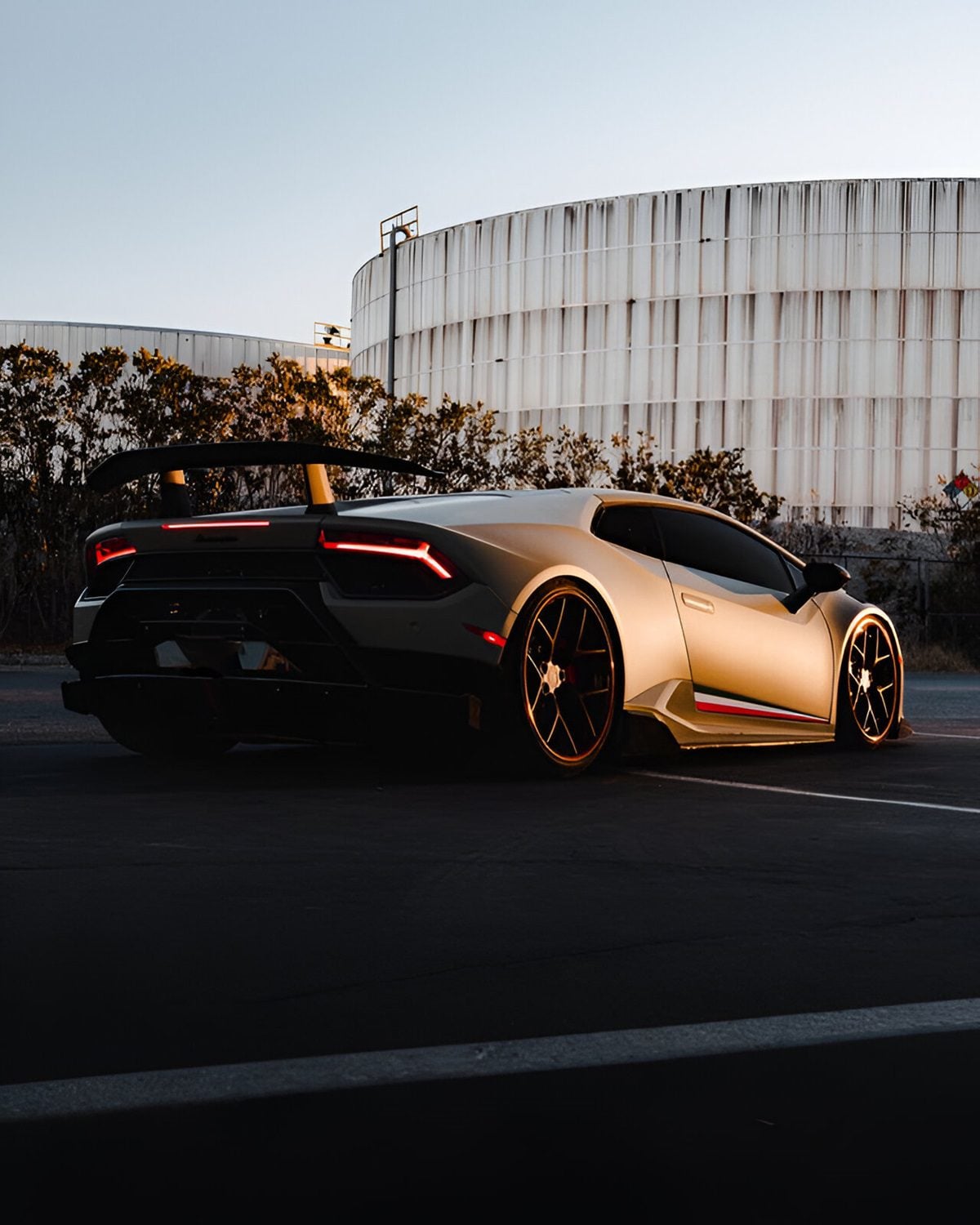 Bronze Huracan Performante rear three-quarter at sunset