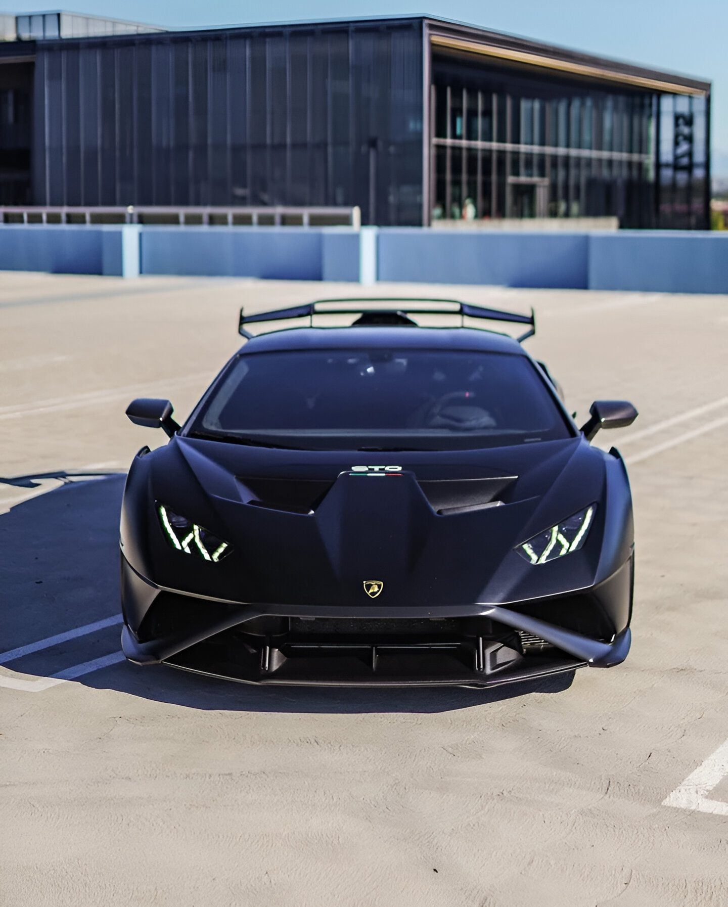 Matte black Lamborghini Huracan STO front view with the 1016 aero kit