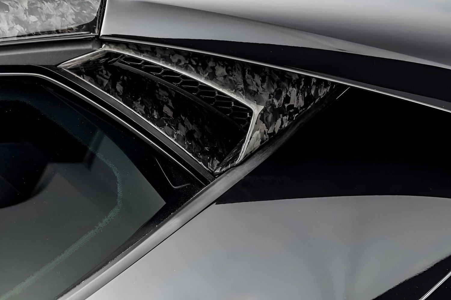Forged carbon side intake vent on a Huracan STO, close-up