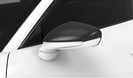 Carbon mirror cap on a white Porsche 911 GT3 (992)