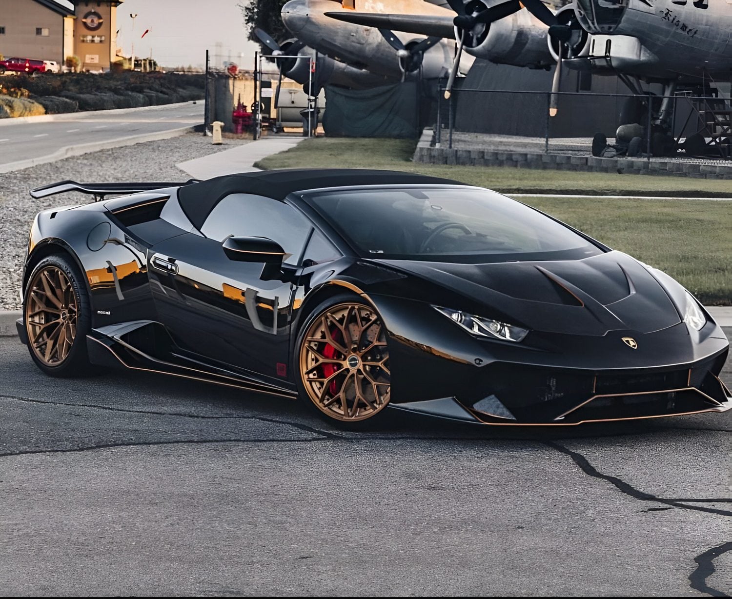 Black Huracan LP610 front three-quarter showing side skirts