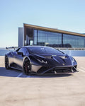 Matte black Lamborghini Huracan STO front three-quarter with the 1016 aero kit