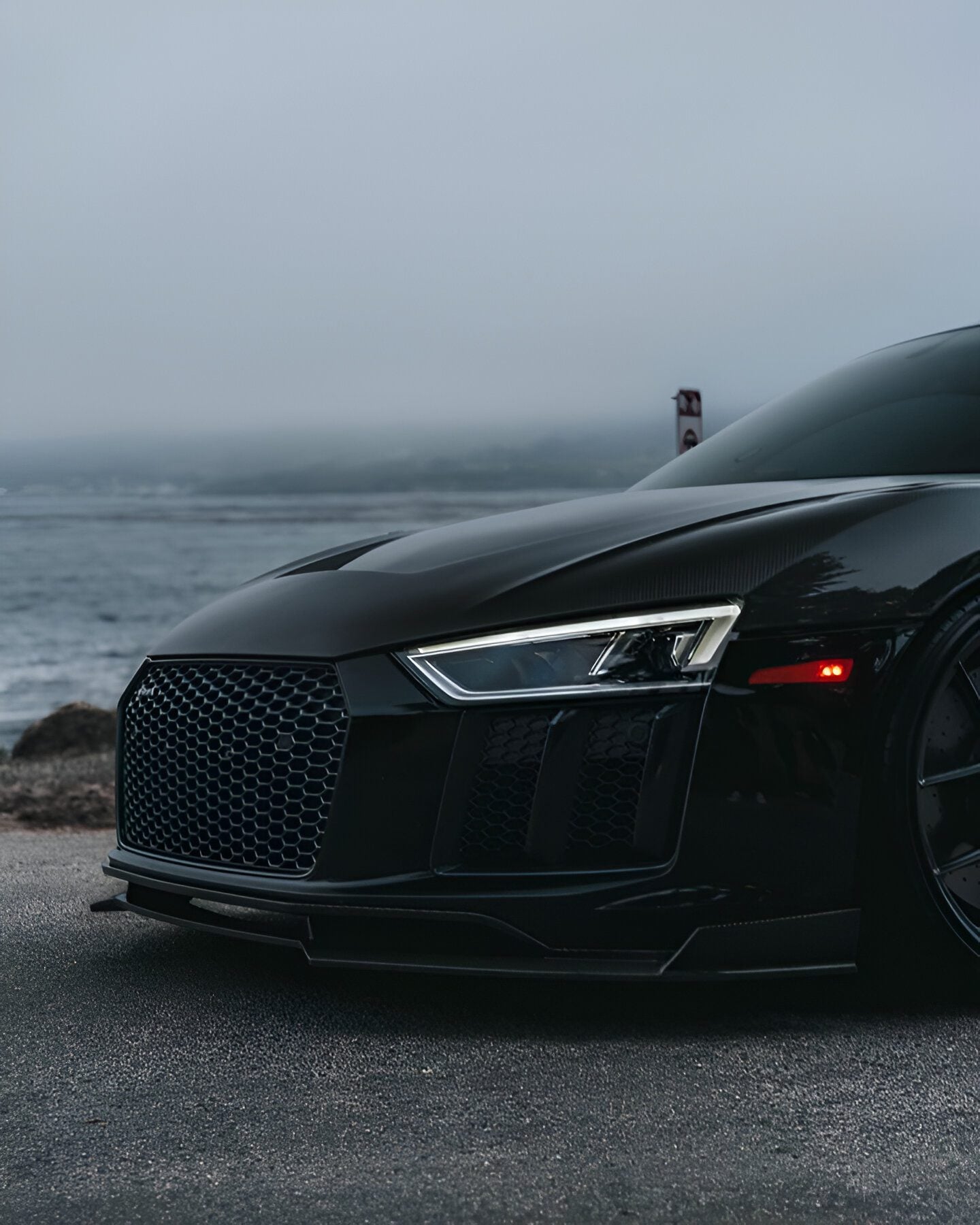 Black Audi R8 (4S) front corner with the complete aero kit, close-up
