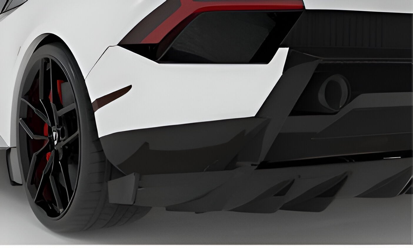 Close-up of the carbon rear diffuser fins on a white Huracan