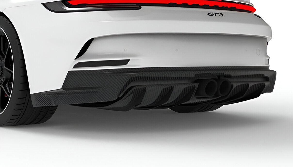 Carbon upper rear diffuser on a white Porsche 911 GT3 (992)