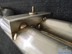 A close up view of Shark Werks Exhaust for Porsche 997 GT2 and GT2RS pipe with a black background
