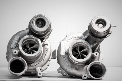 A front overview of Pure Turbos BMW S63/S63tu Stage 2 Upgrade Turbos with a plain background