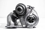 A close up front view of Pure Turbos BMW N54 Pure STG1 Upgrade Turbos behind a white background