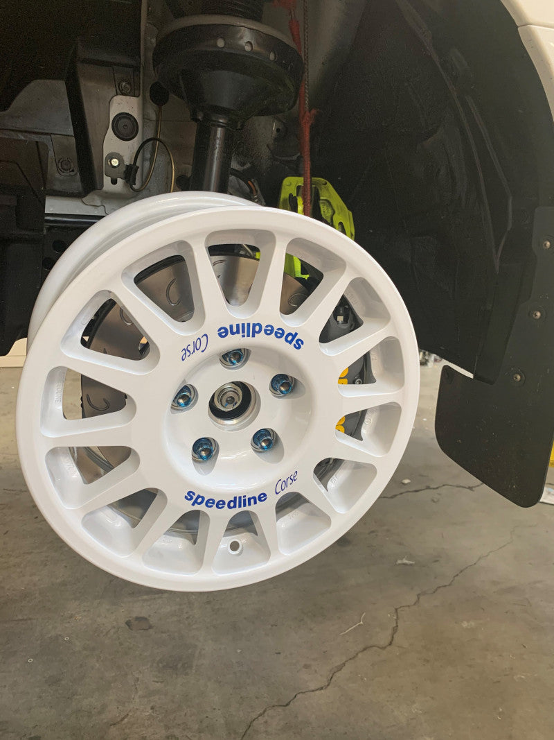 A view of AP Racing by Essex Rally Competition Brake Kit (Front CP8350/299mm)- Subaru 2.5RS, WRX, STI fitted on a car wheel