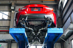A back view of a lifted red car fitted with FI Exhaust Valvetronic Cat-Back System For Lexus RC F 2015+