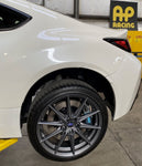 A close up view of a white car with the back wheel fitted with AP Racing by Essex Radi-CAL Competition Brake Kit (Rear CP9451/340mm) - Subaru BRZ, Scion FR-S & Toyota GT86/GR86 2013+