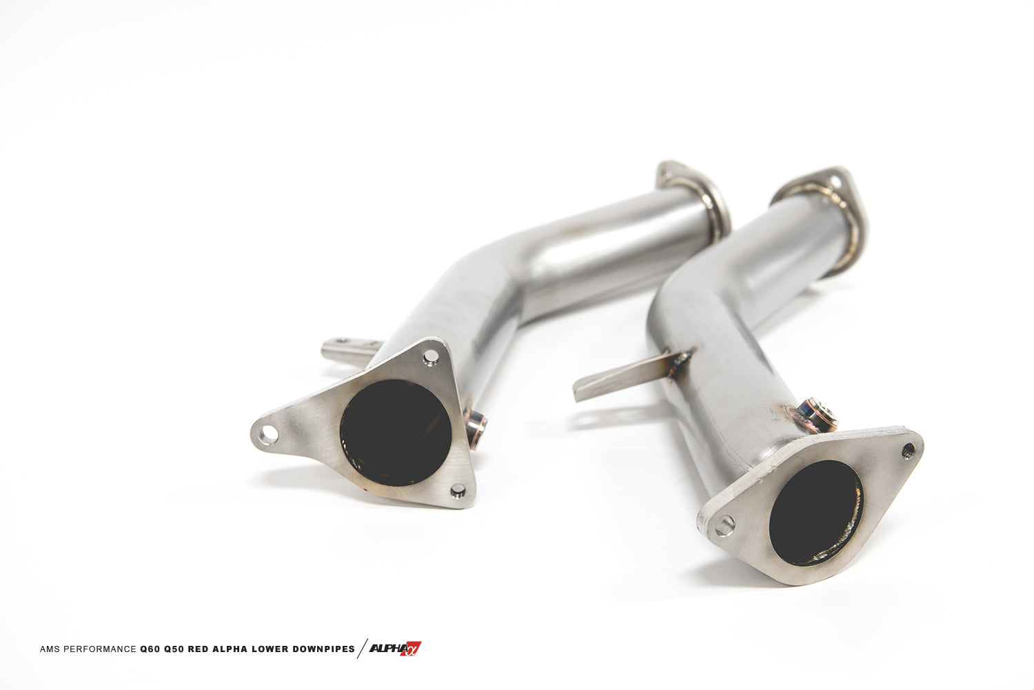 AMS VR30 race lower downpipes at an angle showing the inlet flanges and mounting brackets