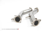 AMS VR30 race lower downpipes at an angle showing the inlet flanges and mounting brackets