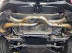 A view of Shark Werks Race Exhaust for Porsche 992 / Carrera / S / Turbo fitted on a car from underneath