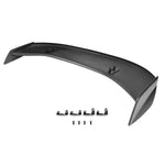 A carbon fiber wing with white background and hardware - 718 GT4