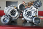 A front view of Pure Turbos BMW S63 / S63tu Stage 1 Upgrade Turbos on the table