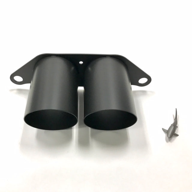 A top view of Shark Werks 100mm Exhaust Tips for Porsche 991 / 991.2 GT3 / RS / R with a small toy shark on the right side