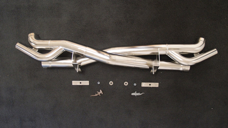 A top view of Shark Werks Exhaust for Porsche 991 / 991.2 Turbo / S with a black background